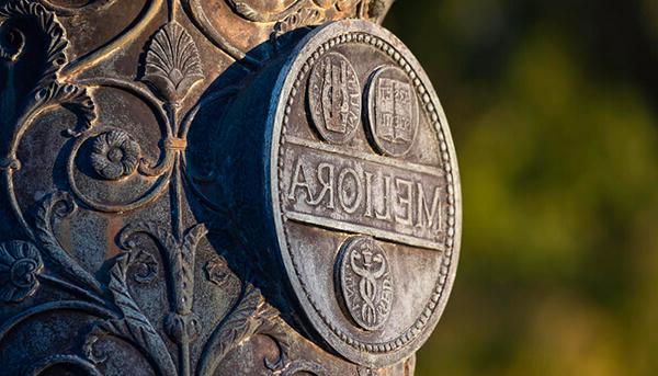 meliora symbol engraved on a statue